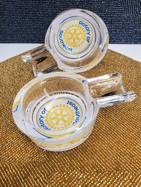 (2) Vintage glass ashtrays with the emblem of Rotary International Southeast Reg